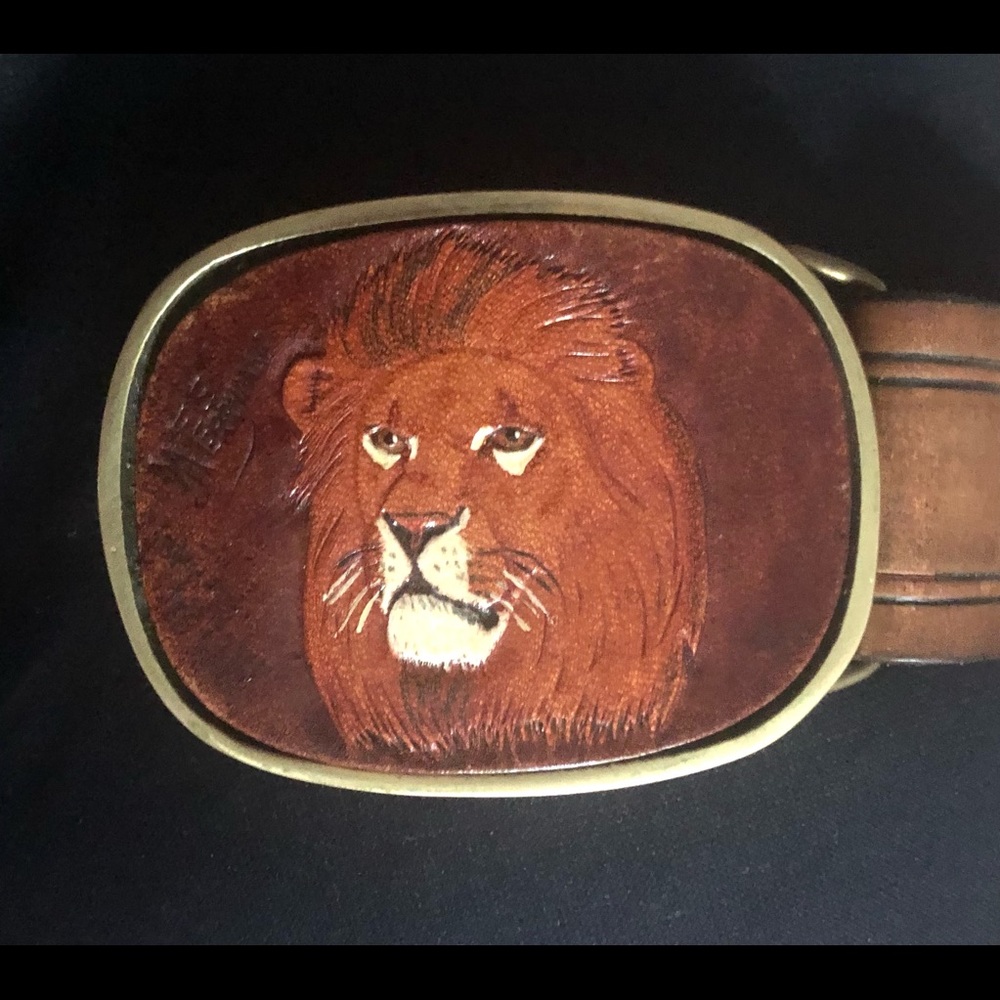 Sold brass belt buckle with lion head painted on leather
